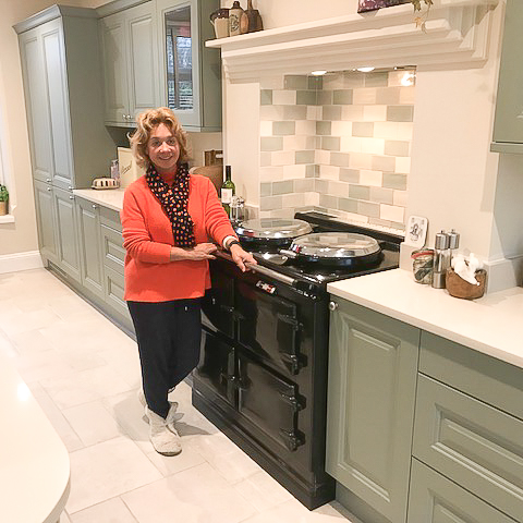 Mrs Howarth stood next to her black aga cooker