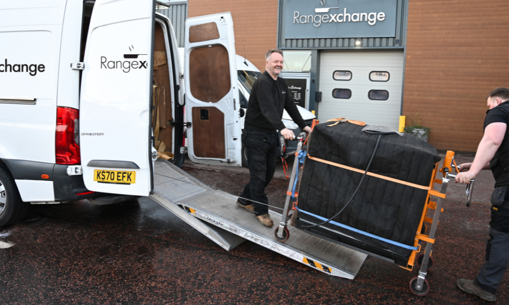 A picture of the range exchange team delivering and installing a reconditioned aga cooker